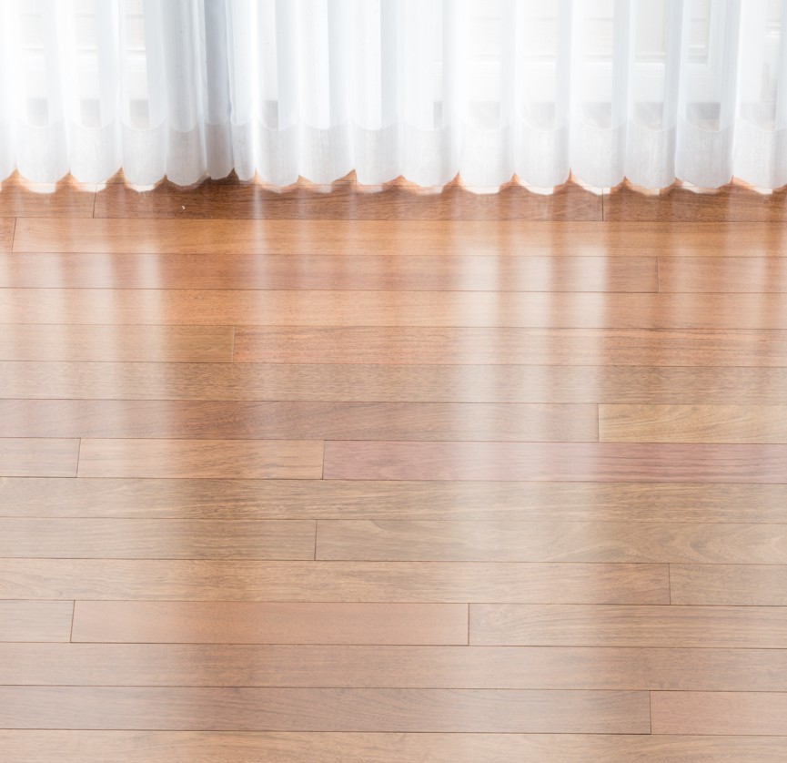 Top-rated polished hardwood showcasing golden wood with mirror-like finish installed near Petersburg Virginia