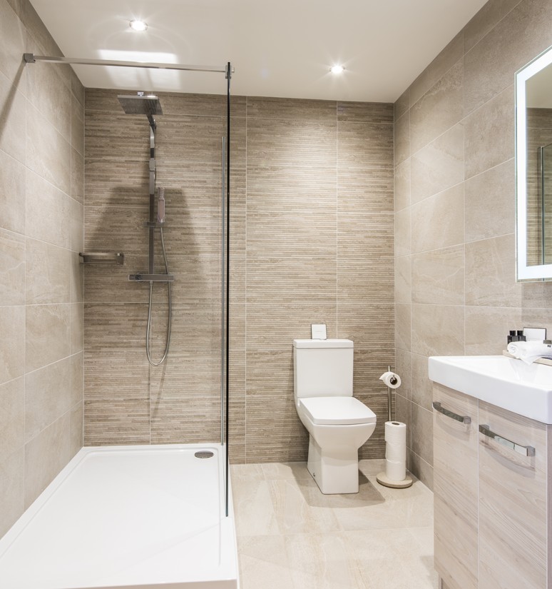 Premium bathroom tile installation with warm taupe and sleek appearance serving Petersburg Virginia metro area