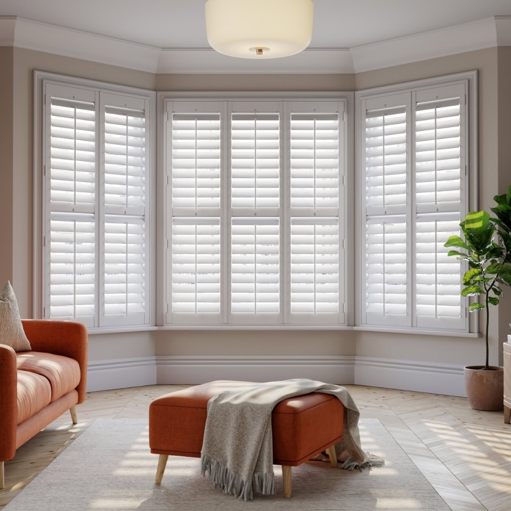 bespoke fitted bay window shutters in modern lounge