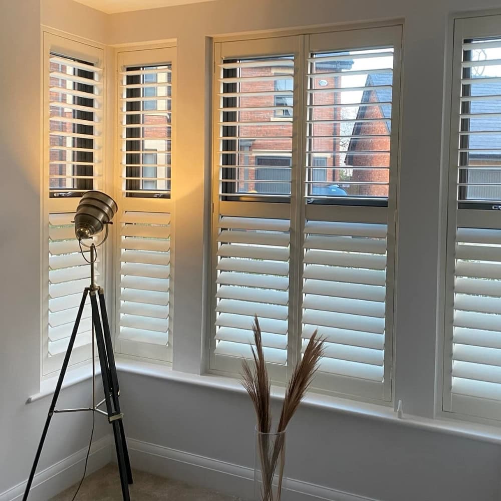 white full height shutters in modern home