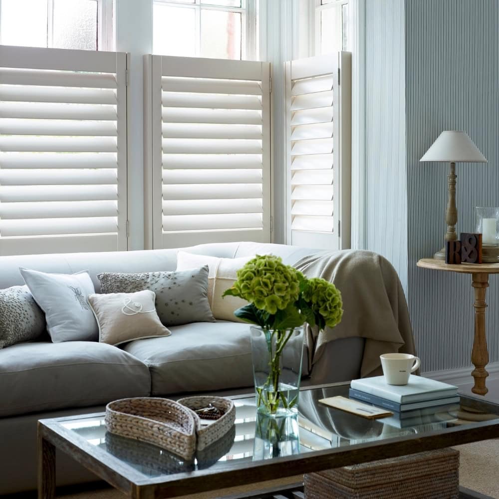 white finished cafe style shutters in living room