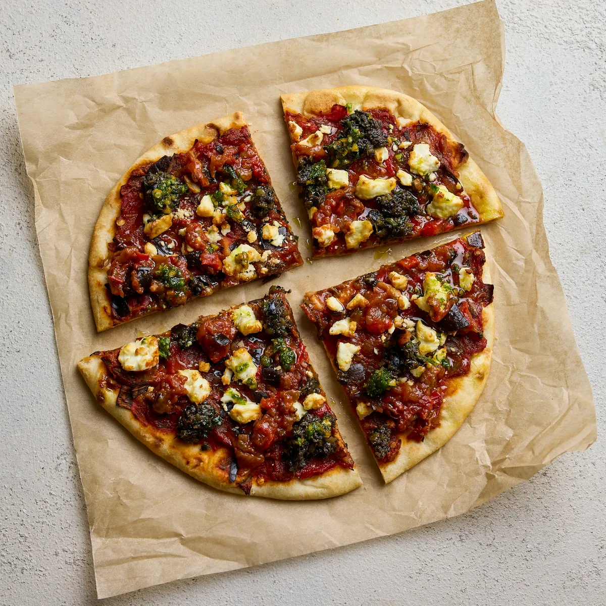 A rustic pizza cut into quarters