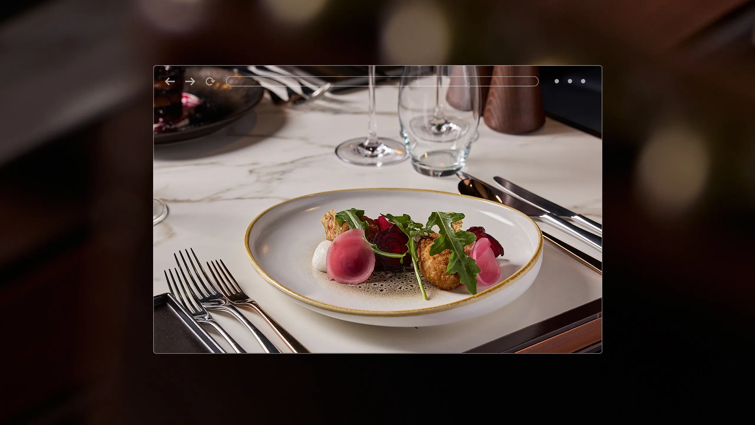 2 desserts on a table in a high end restaurant.