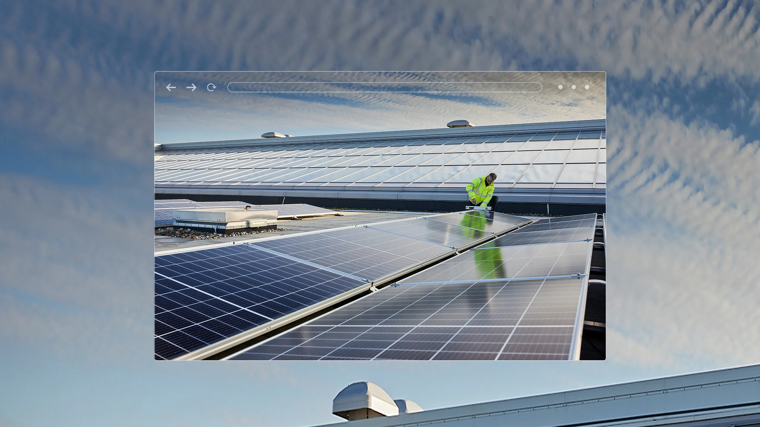 An image of someone working on solar panels with a sky background.