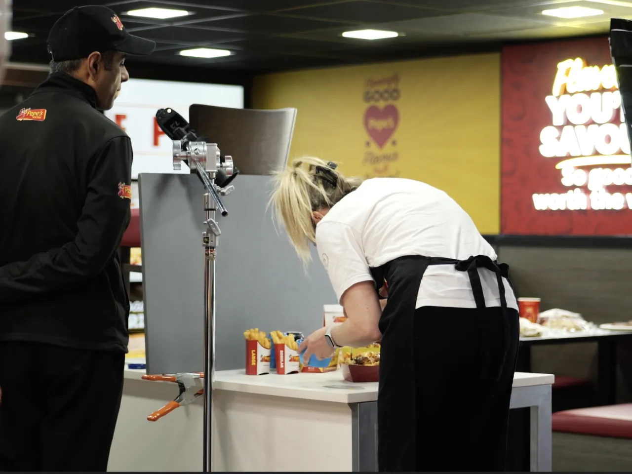 A food stylist creating an image for Pepe's