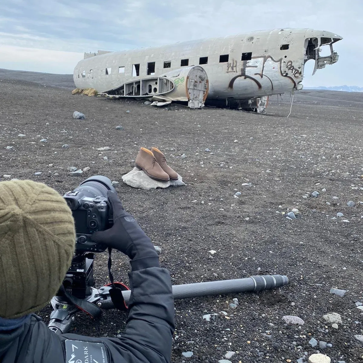 A photographer shooting some shoes with a stunning backdrop.