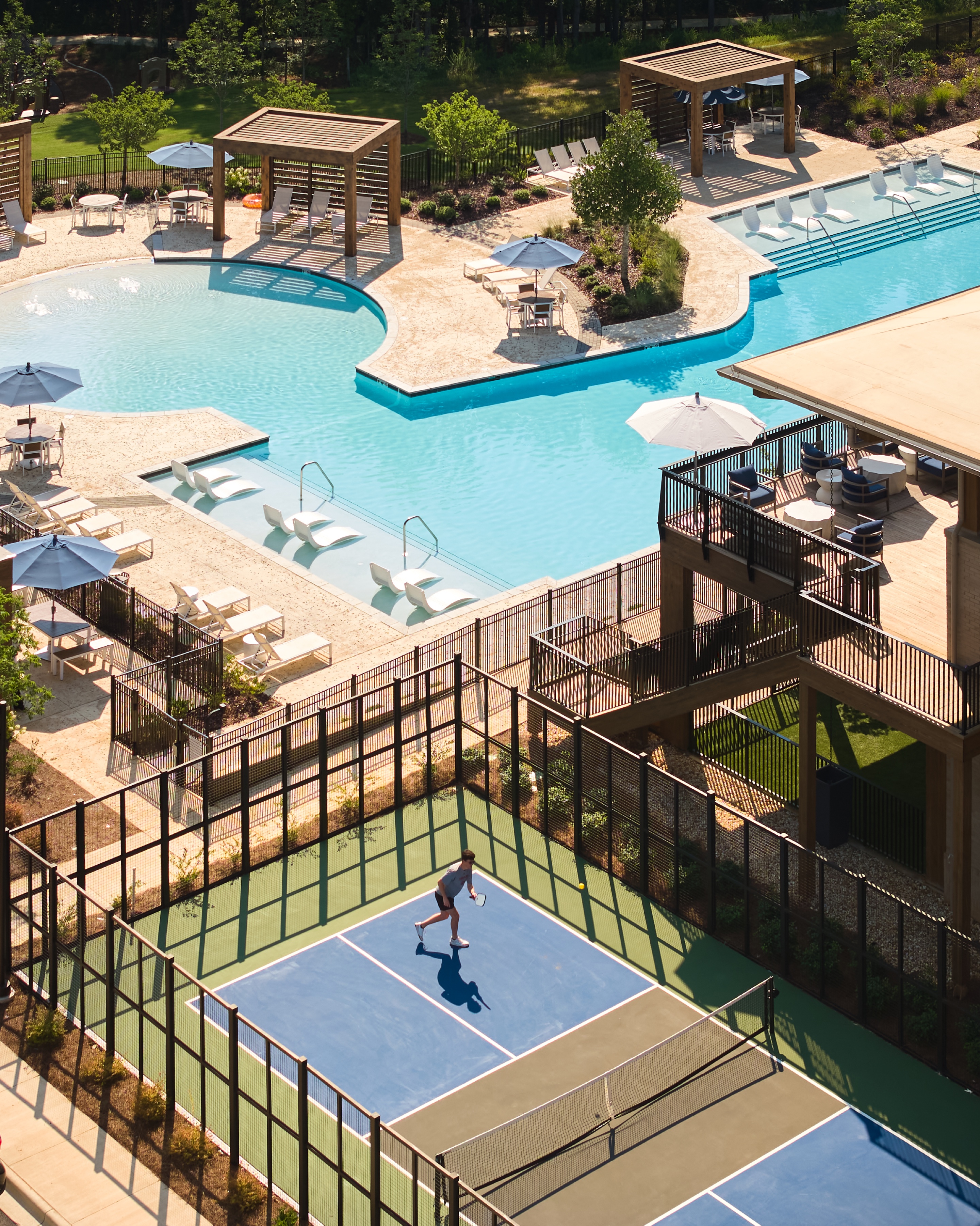Everlee Clubhouse pool deck and pickleball courts seen from above, architectural photography by Omar Mohammad Studio
