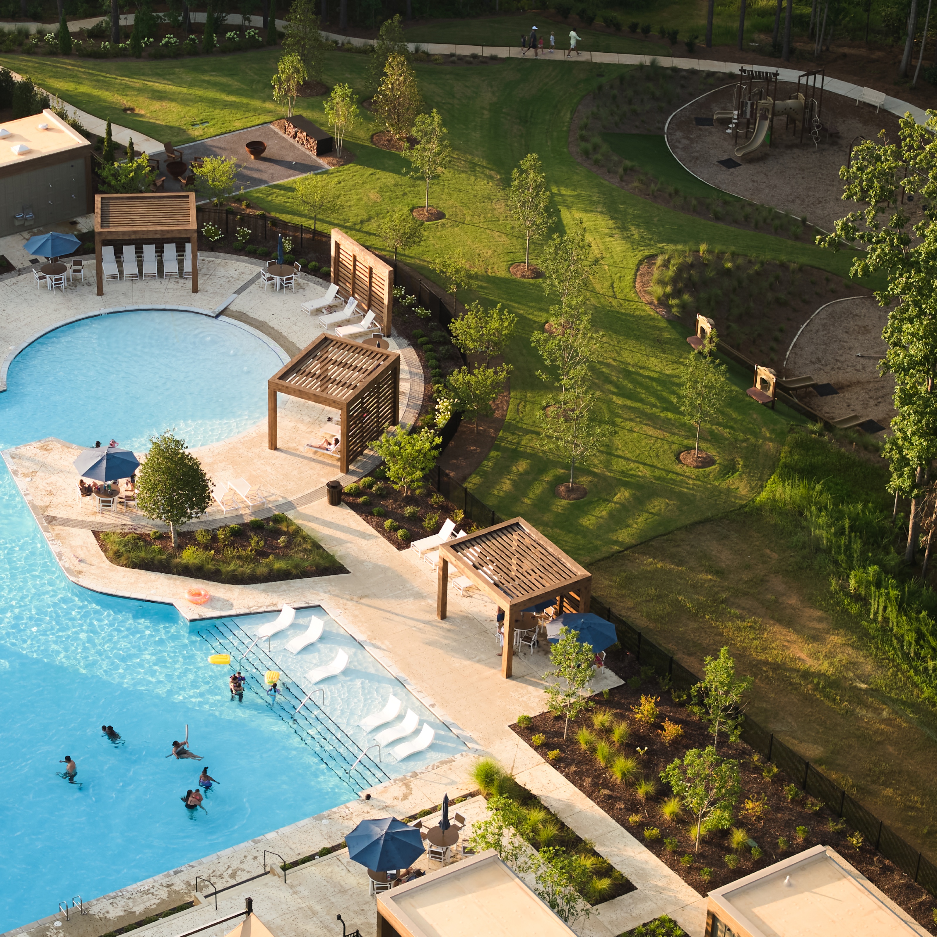 Aerial view of the Everlee Clubhouse zero entry pool, cabanas and playground beyond, architectural photography by Omar Mohammad Studio