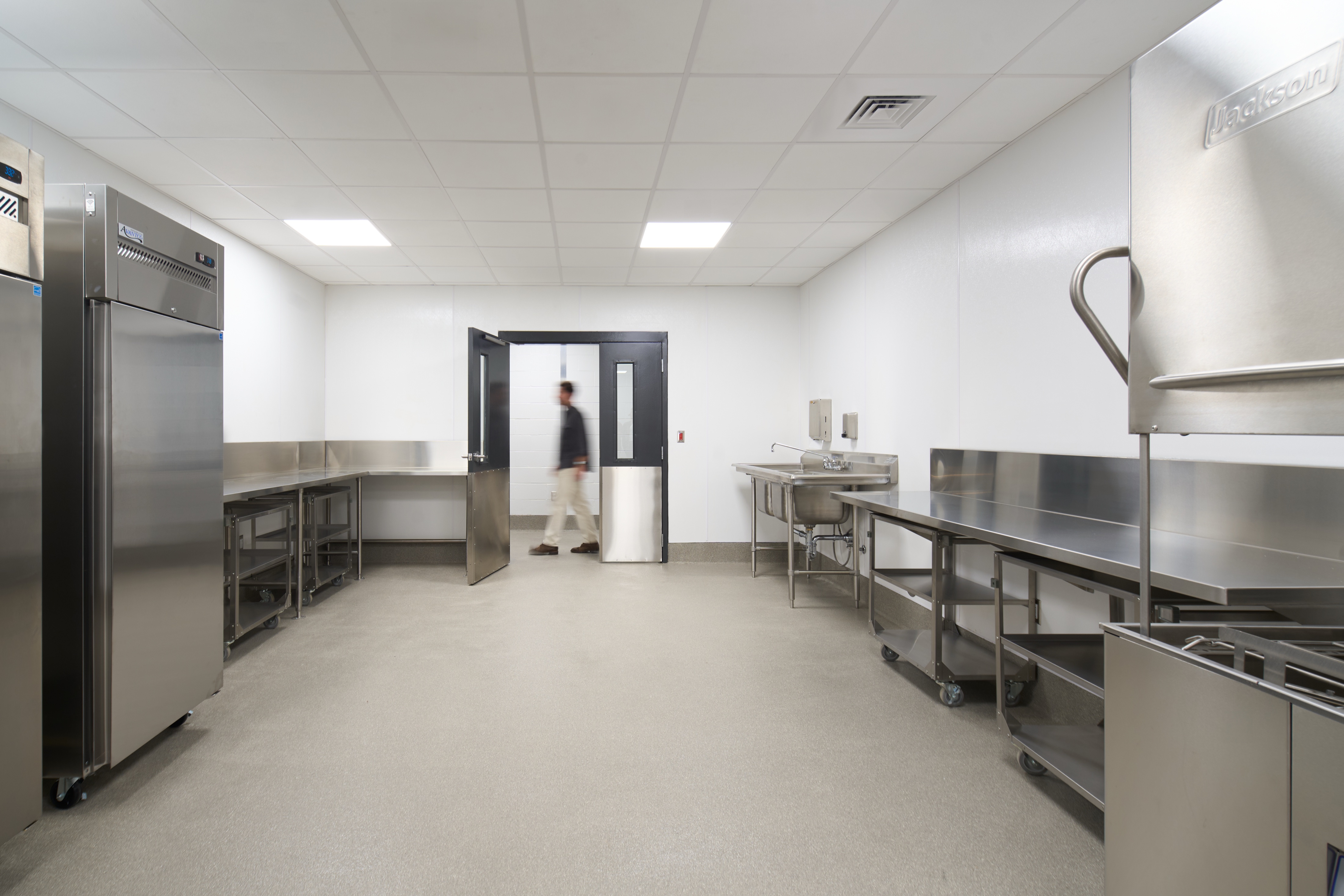Stainless food preparation room with commercial hood at Jefferson County Animal Control, civic architecture photography by Omar Mohammad Studio