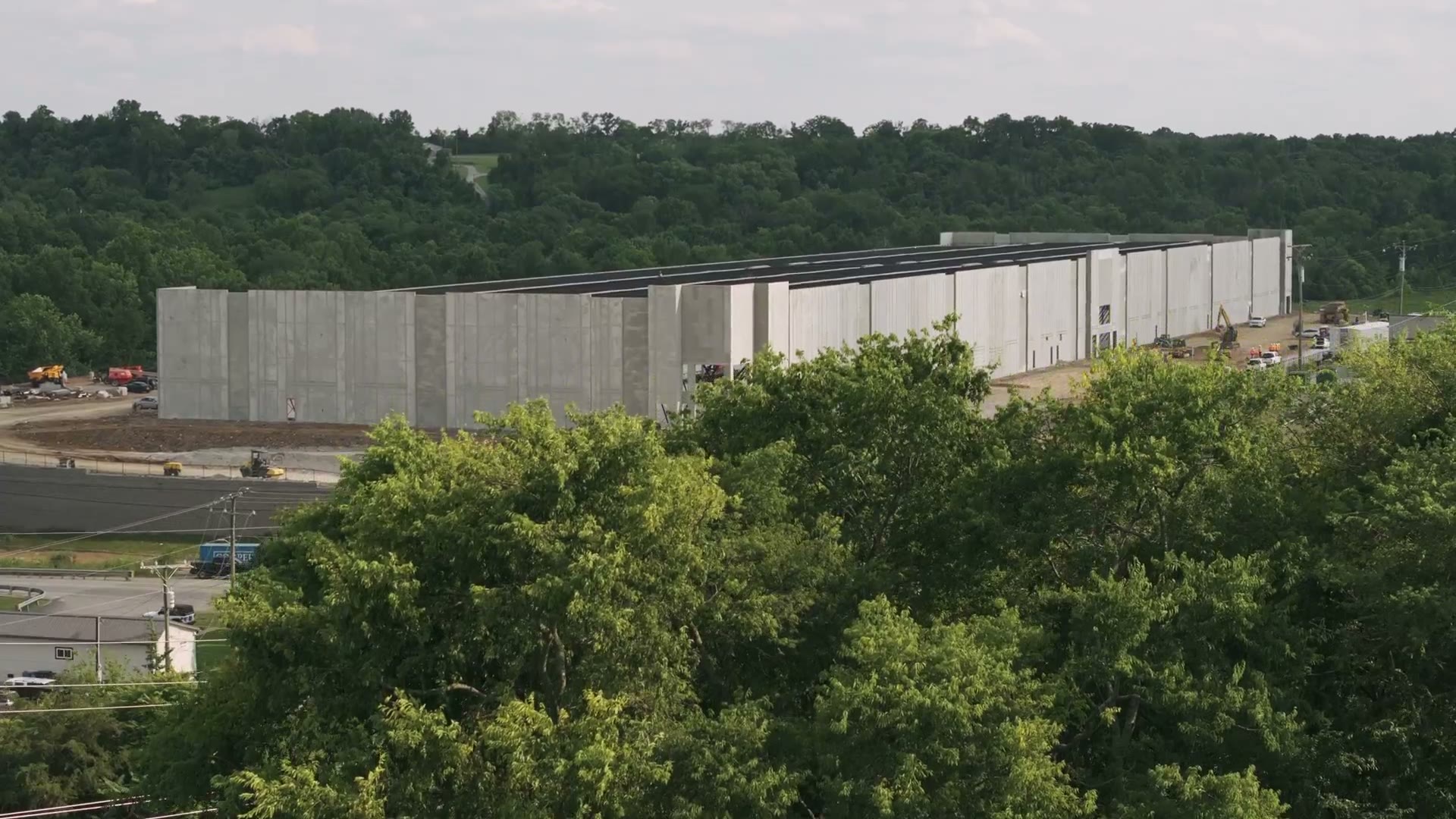 Drone frame of the tilt-up concrete panels at Hermitage during steel erection
