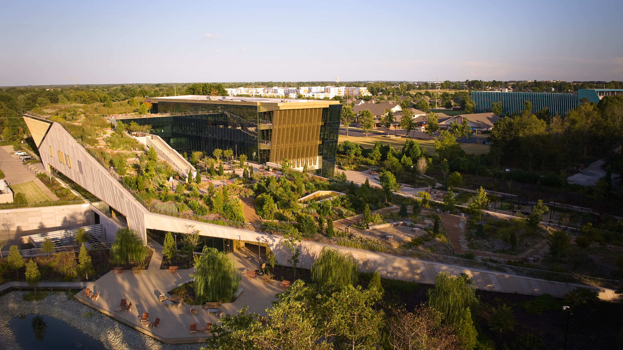 Wide aerial view across the green roof of the Alice L. Walton School of Medicine, architectural photography by Omar Mohammad Studio