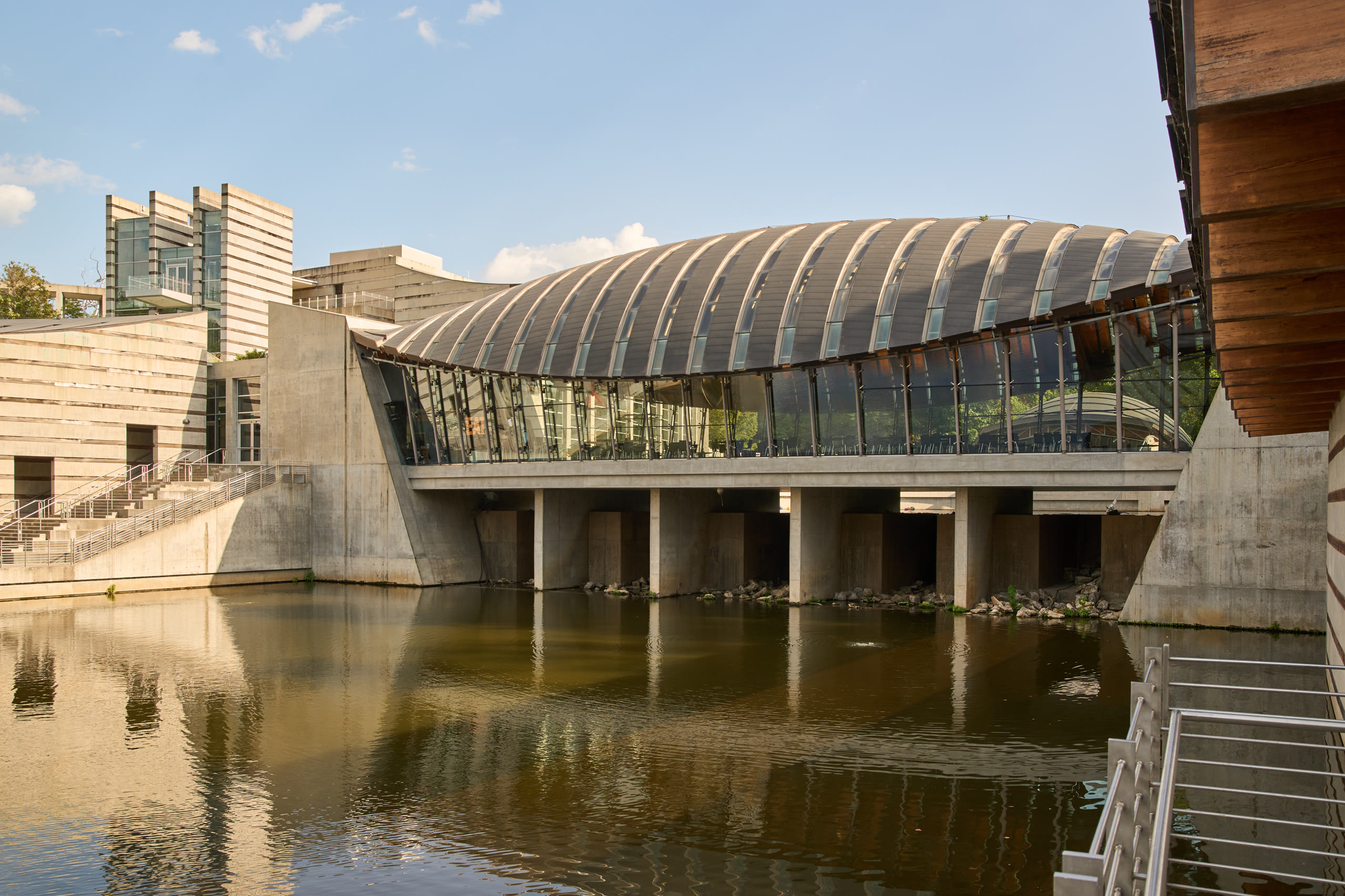 Crystal Bridges Museum of American Art in Bentonville, Arkansas, from the air to the bridge galleries. Architectural photography by Omar Mohammad Studio.