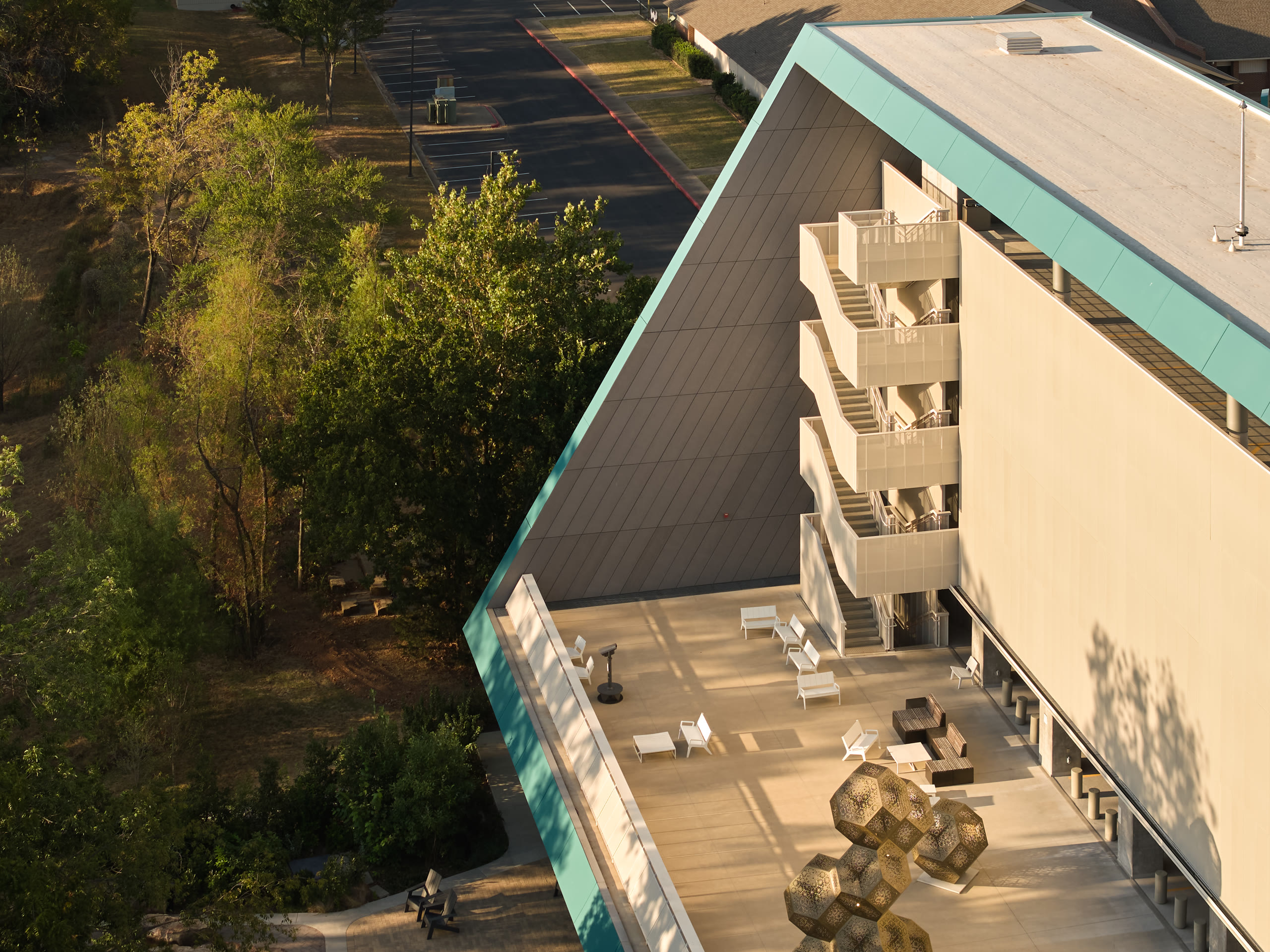 Aerial view down the stepped side of the Crystal Bridges parking deck, architectural photography by Omar Mohammad Studio