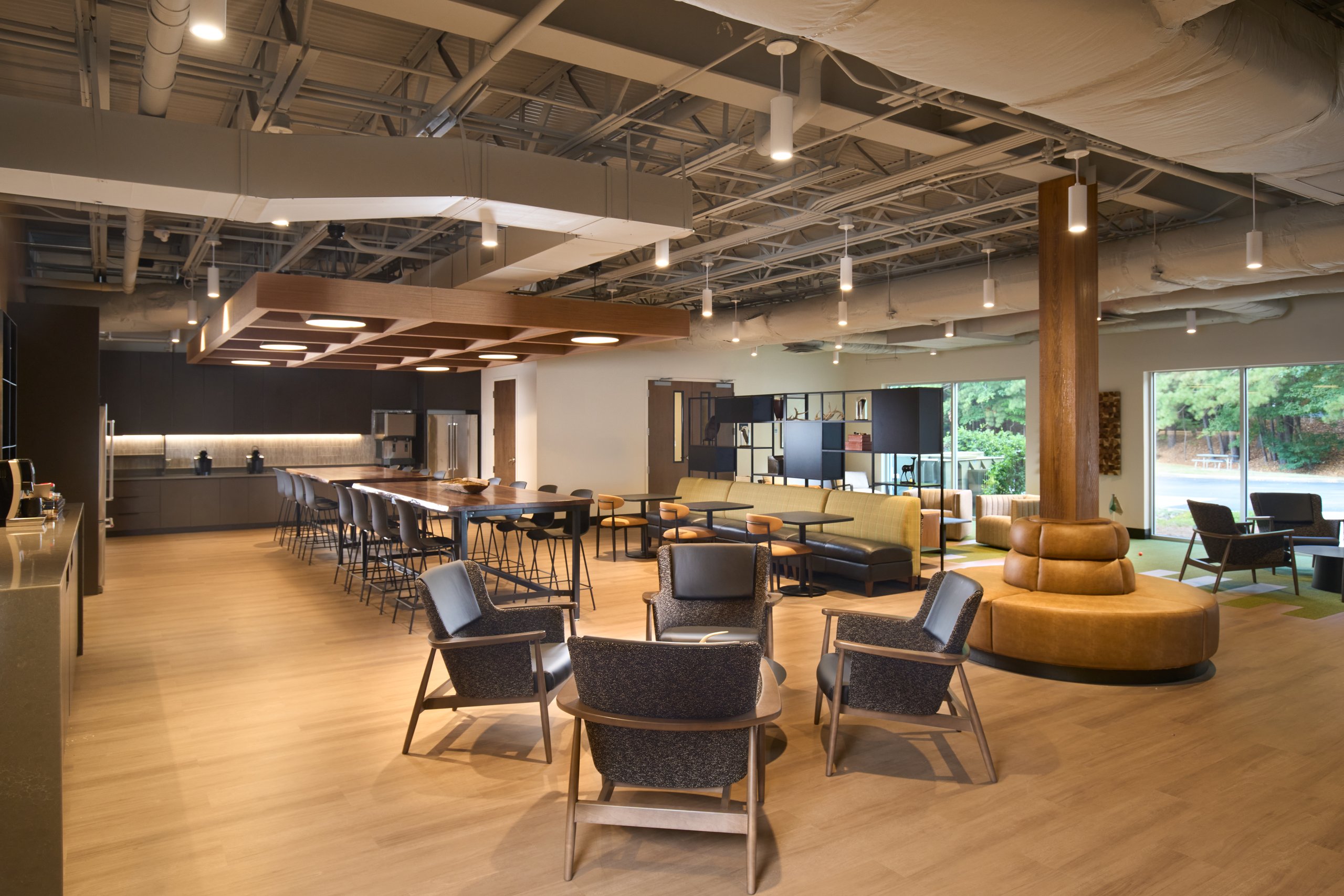 Open seating area under exposed ceilings at the Moultrie office