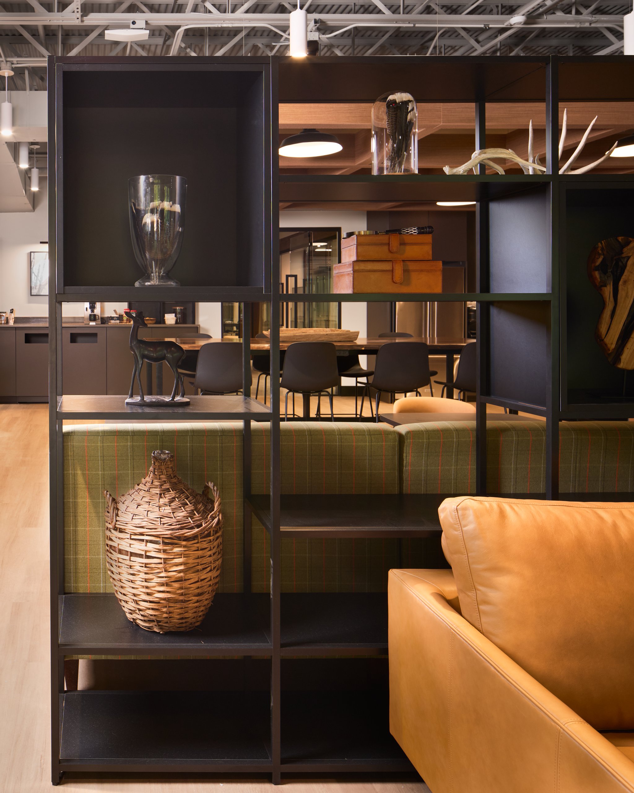 Built-in shelving and a leather sofa in a lounge at the Moultrie office