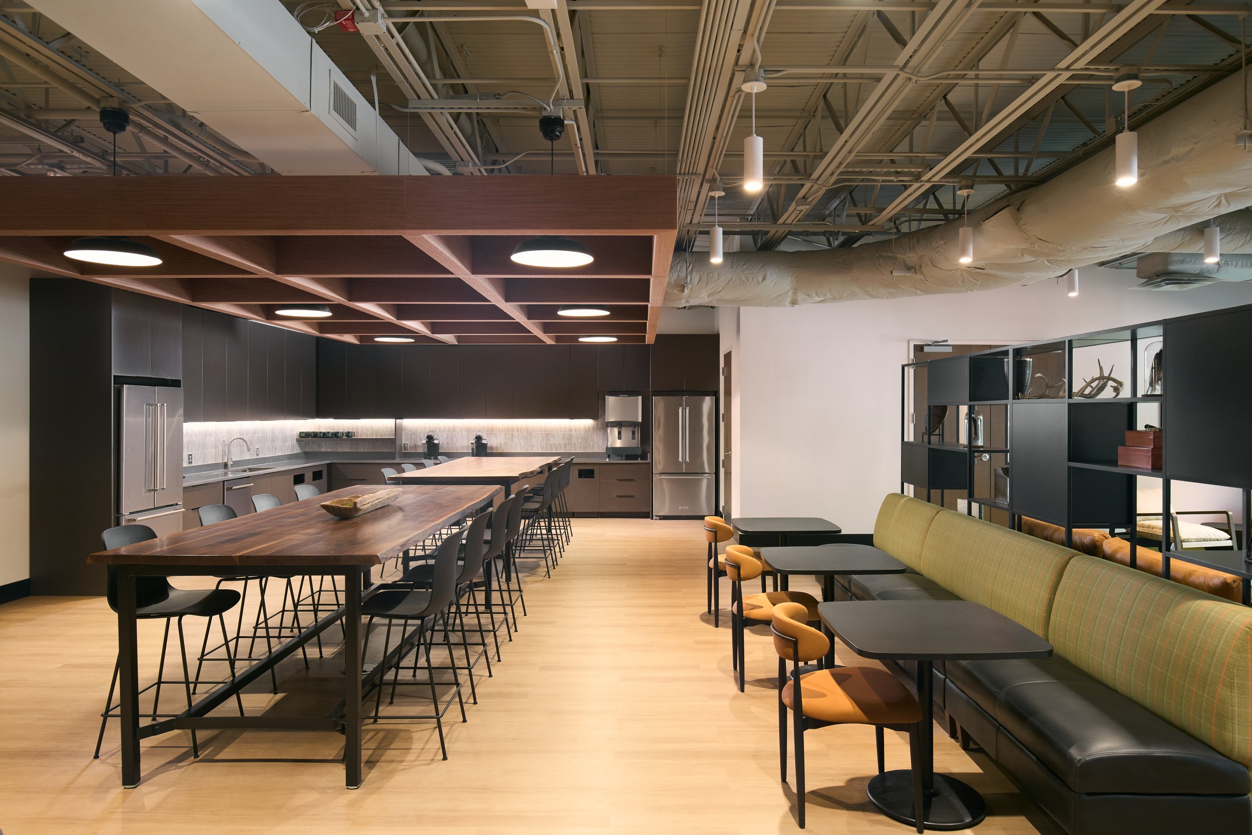 Long table and bar seating in the cafe at the Moultrie office