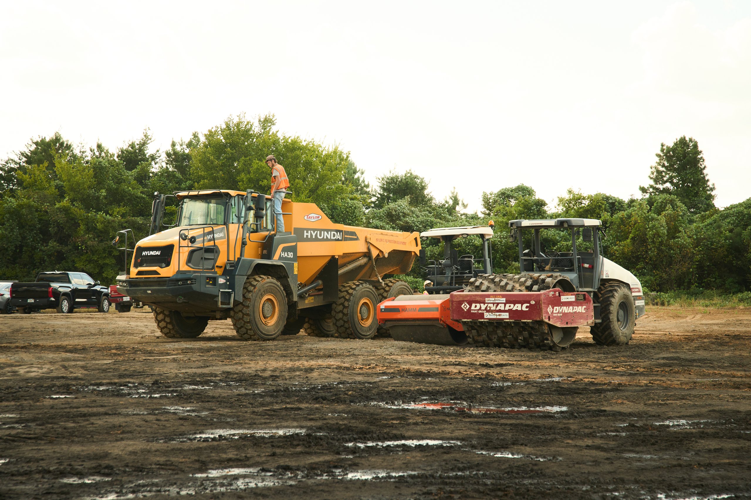 Articulated haul truck and soil stabilizer on the Coalburg site for Cooper Construction, photographed by Omar Mohammad Studio