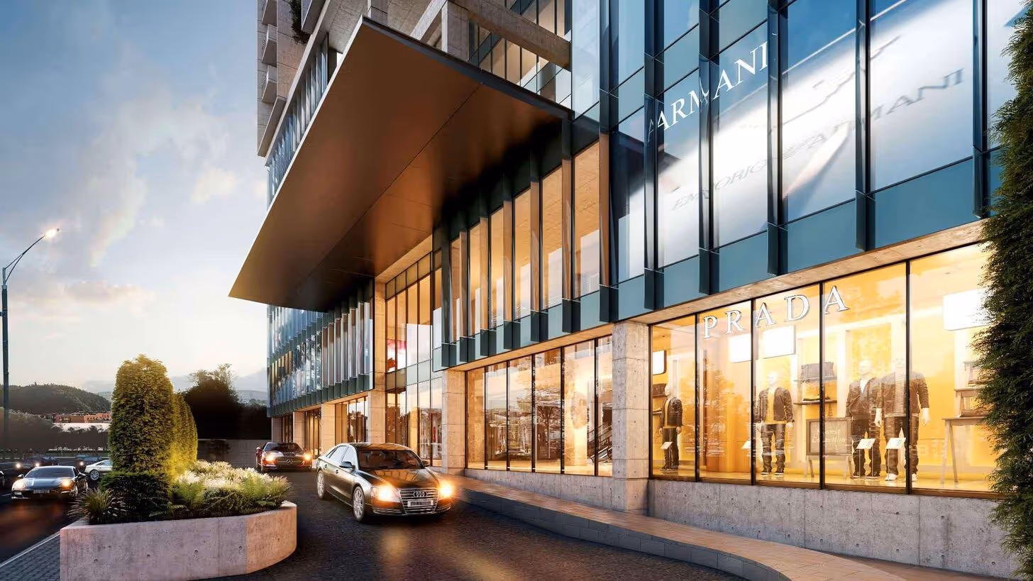 Luxury retail storefronts including Prada and Armani, reflecting Soch’s design inspiration from global urban architecture.