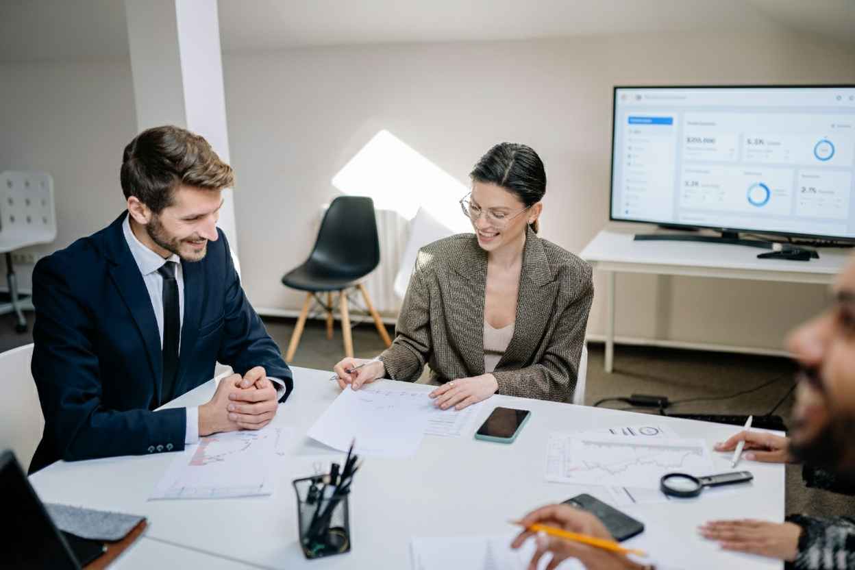 Soch team attending development management training in conference room.