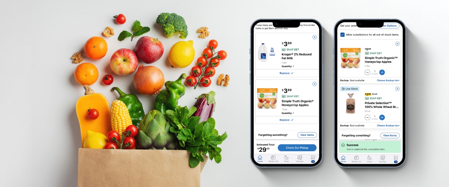 A brown grocery bag overflowing with fresh produce next to two smartphones displaying the Kroger mobile app's "out-of-stock" replacement and substitution features.