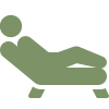 Icon of a person reclining on a therapy couch.