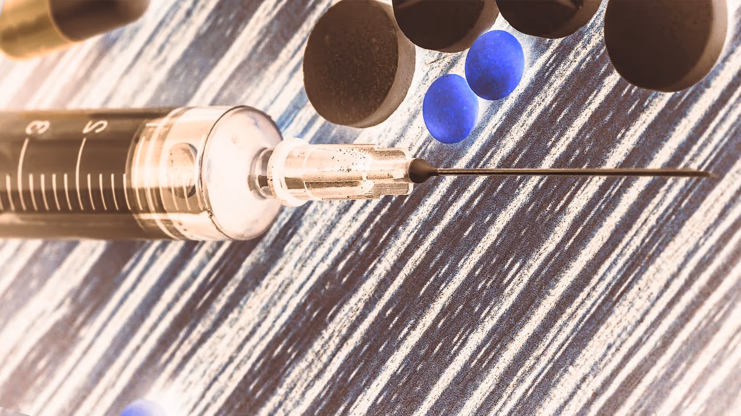 Image of a syringe needle over an abstract background