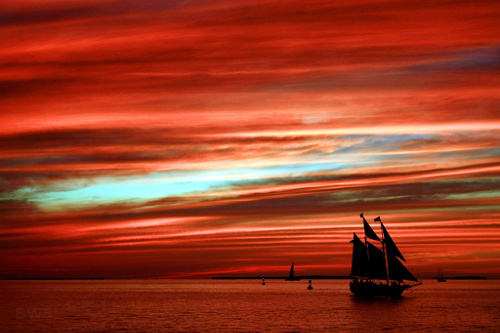Key West's legendary sunsets draw travelers to the southernmost point of the continental US