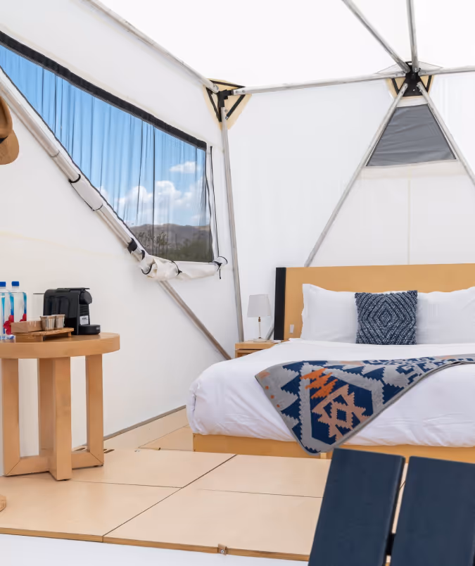 Off-grid glamping tents set among trees at Highland Ranch near Glacier National Park