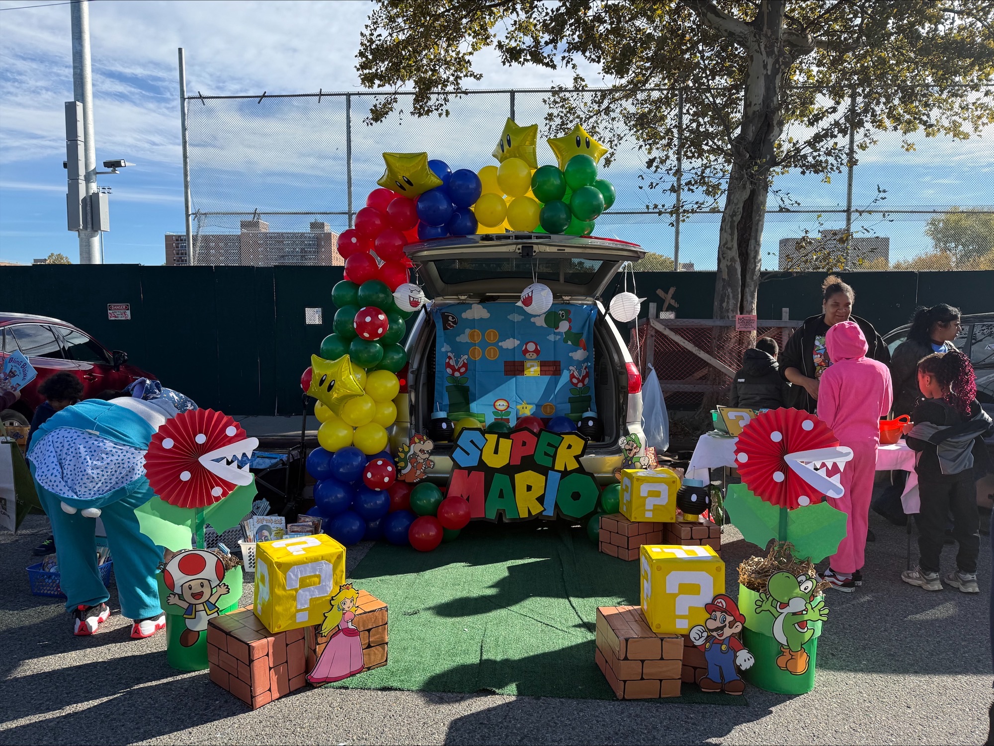Colorful outdoor event with balloons and decorations