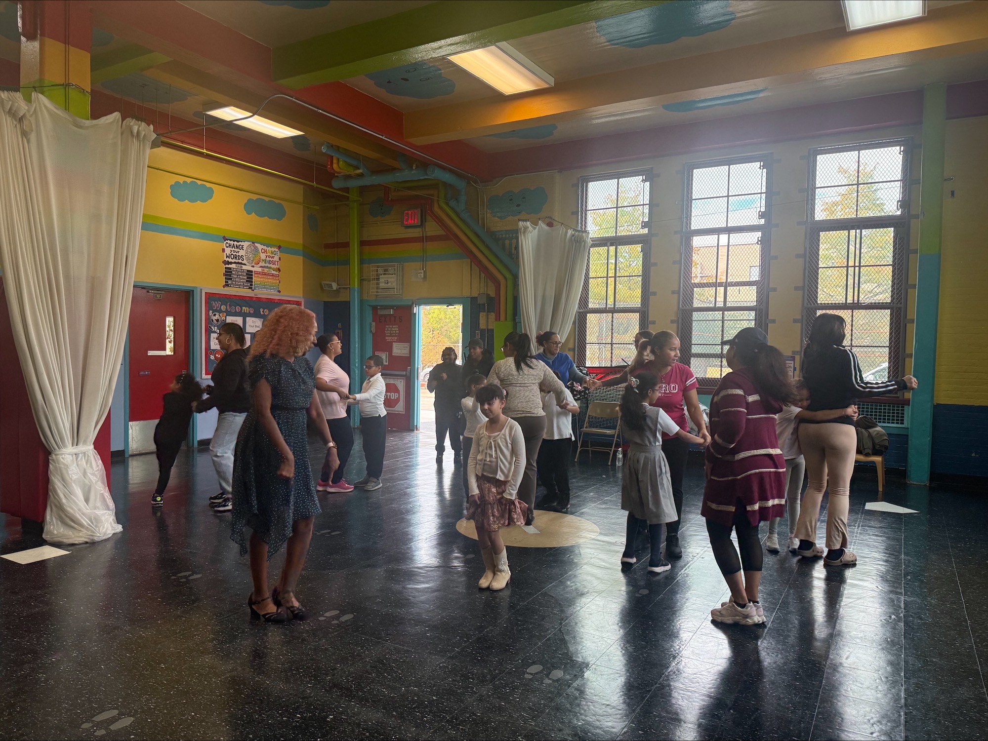 People dancing together in a classroom