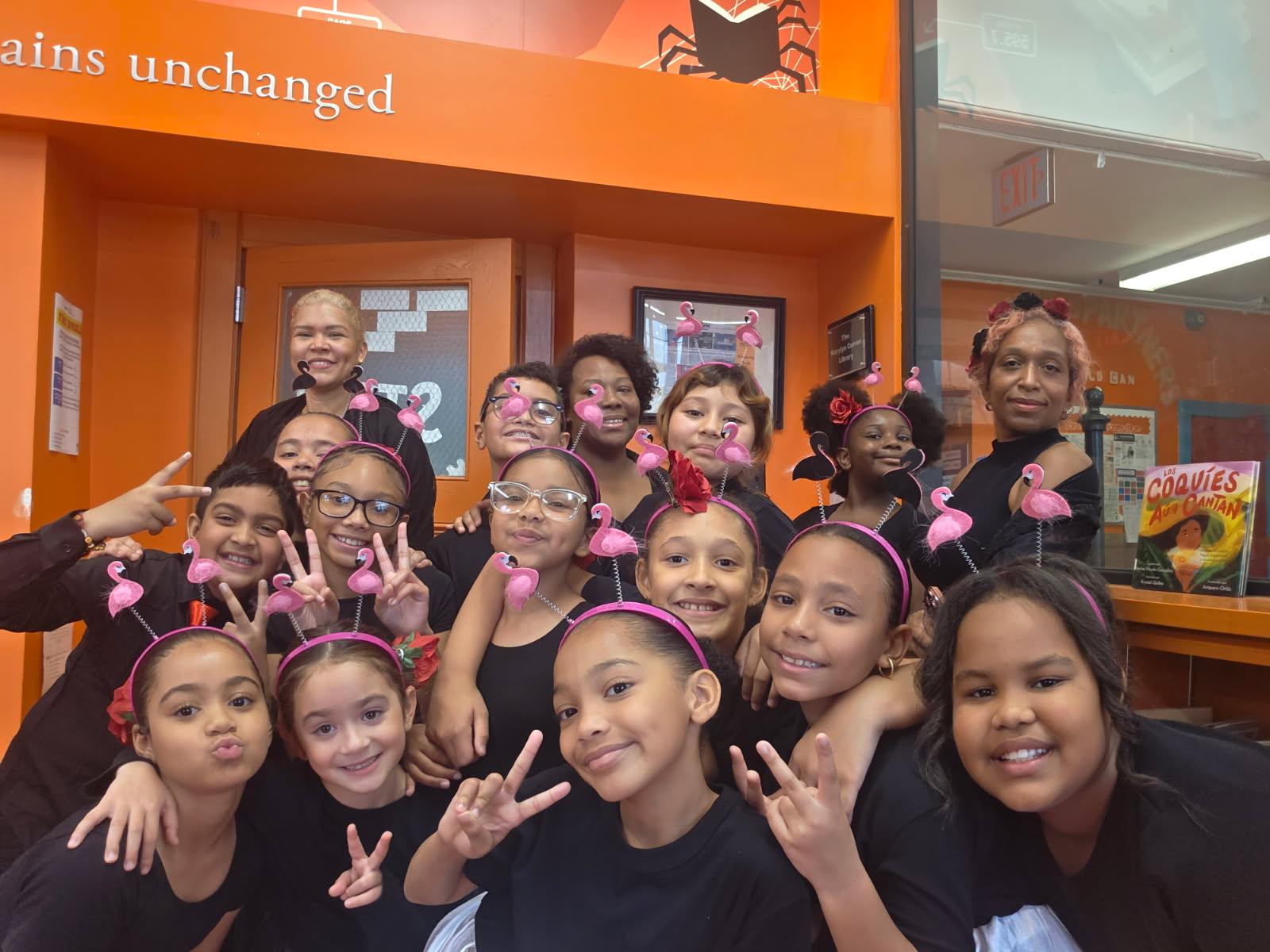 Students smiling in classroom group photo