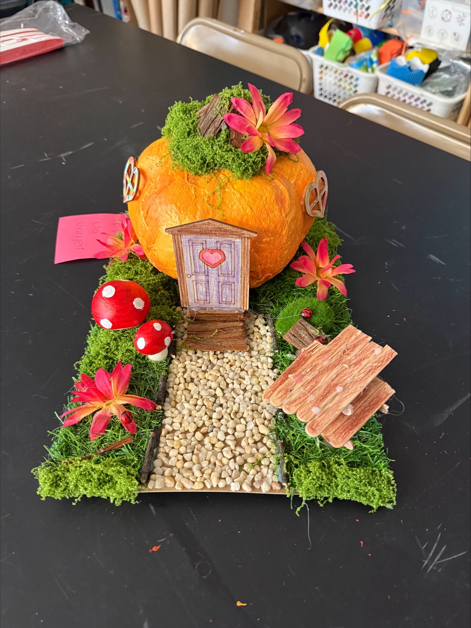 Pumpkin craft house model on display