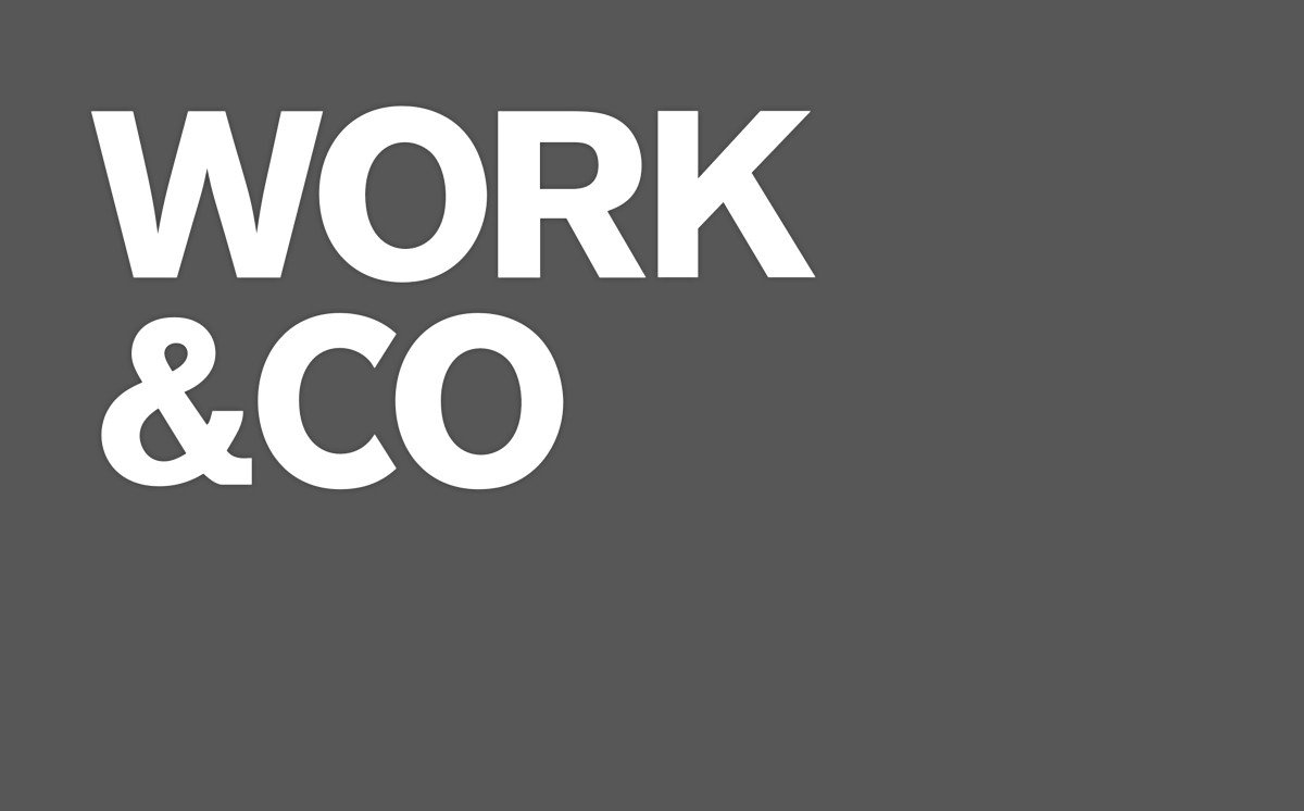 White bold text 'WORK & CO' on a dark gray background.