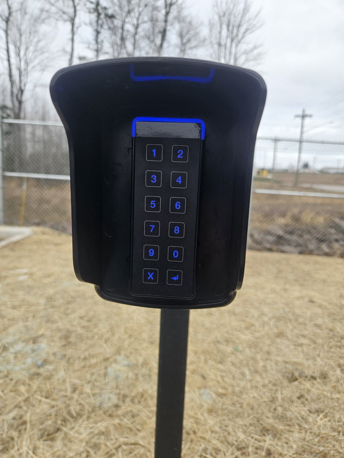 Empty storage unit with concrete floor and corrugated metal walls and ceiling.