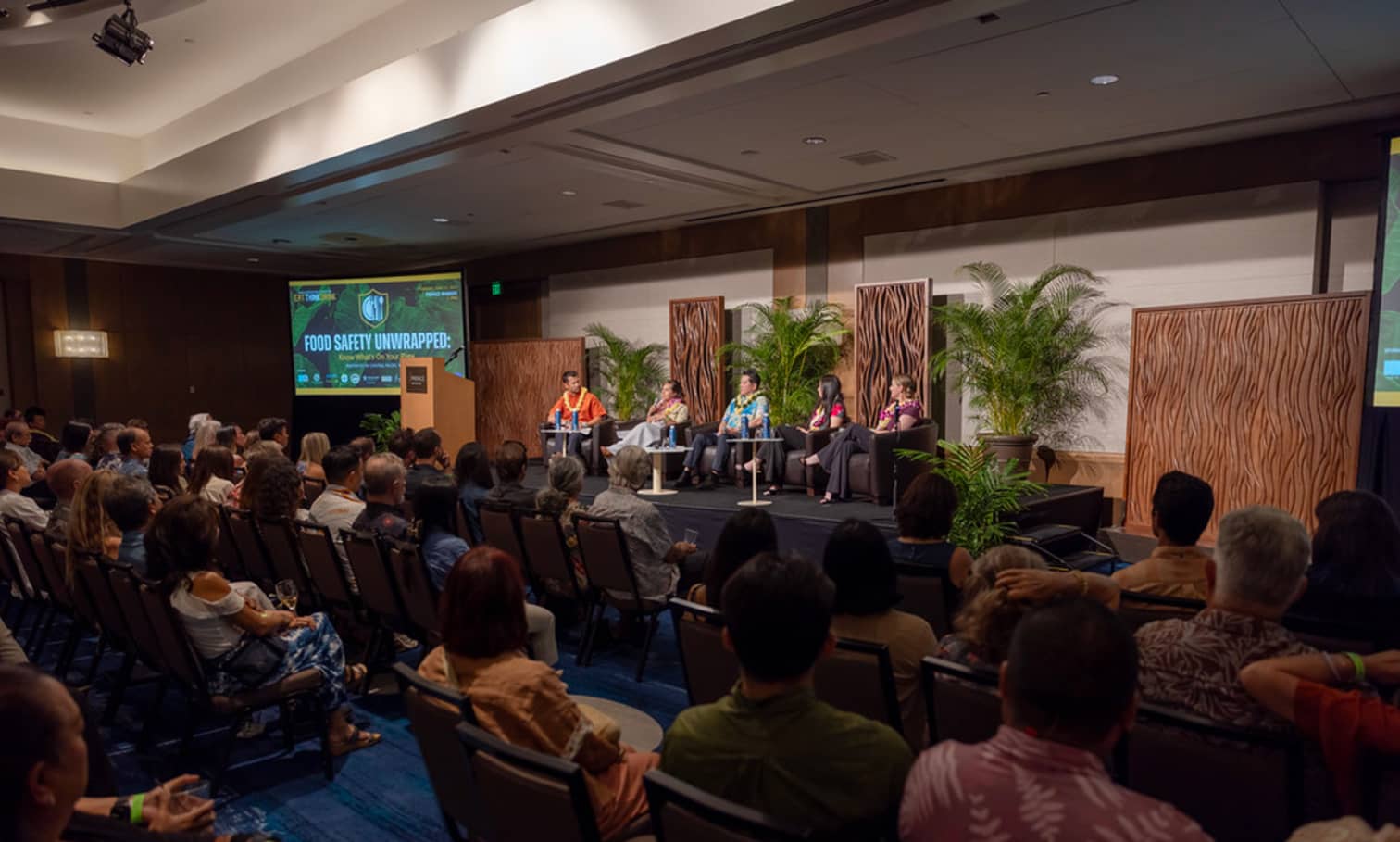 Eat Think Drink panelists in Hawaii Prince ballroom sitting with a moderator.