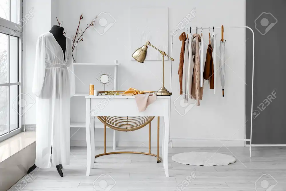 A fashion designer works on a computer, creating virtual fashion sampling efficiency with 3D visualization.