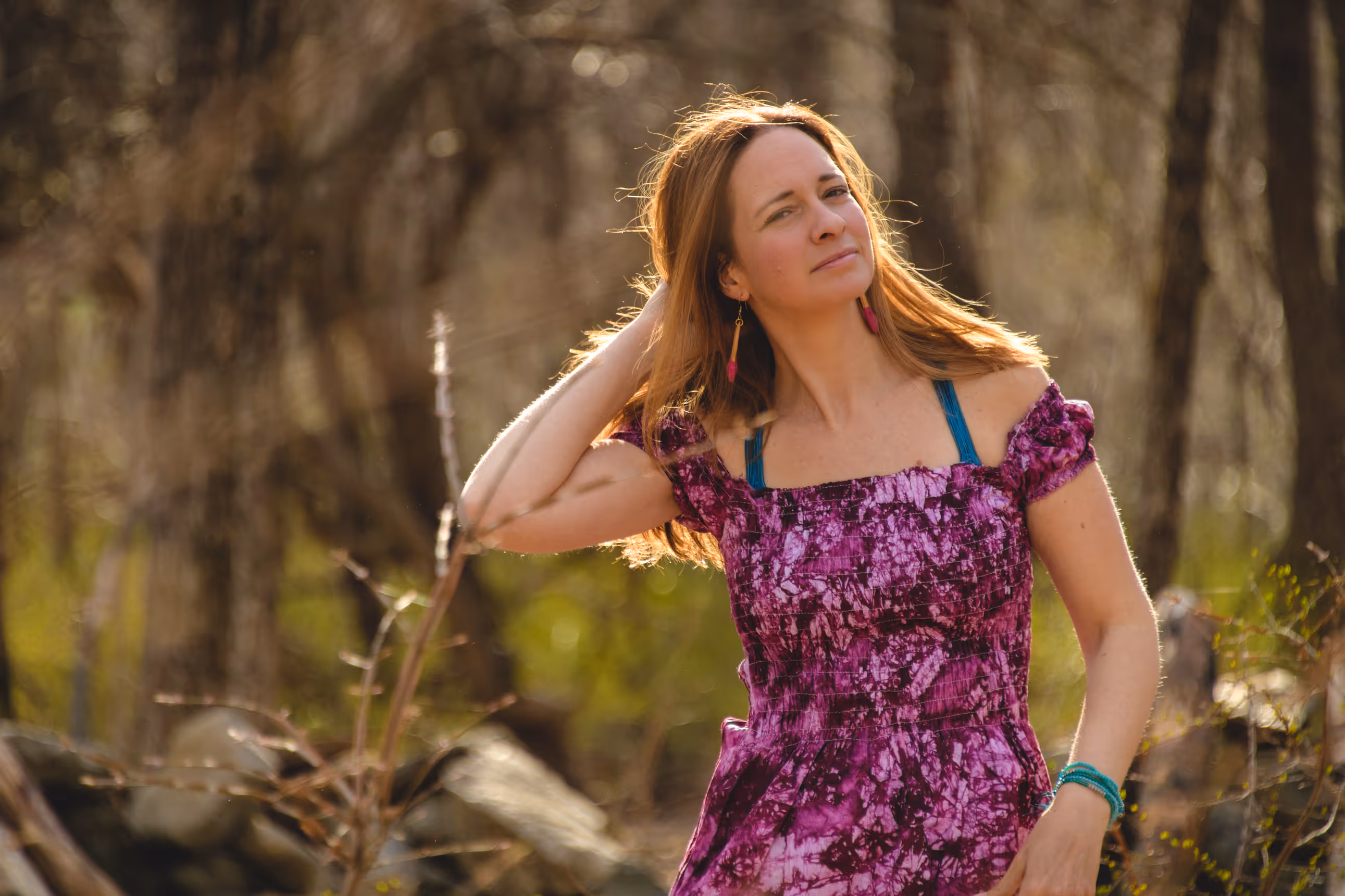 Susan Cote, life coach and aromatherapist, standing outdoors in nature