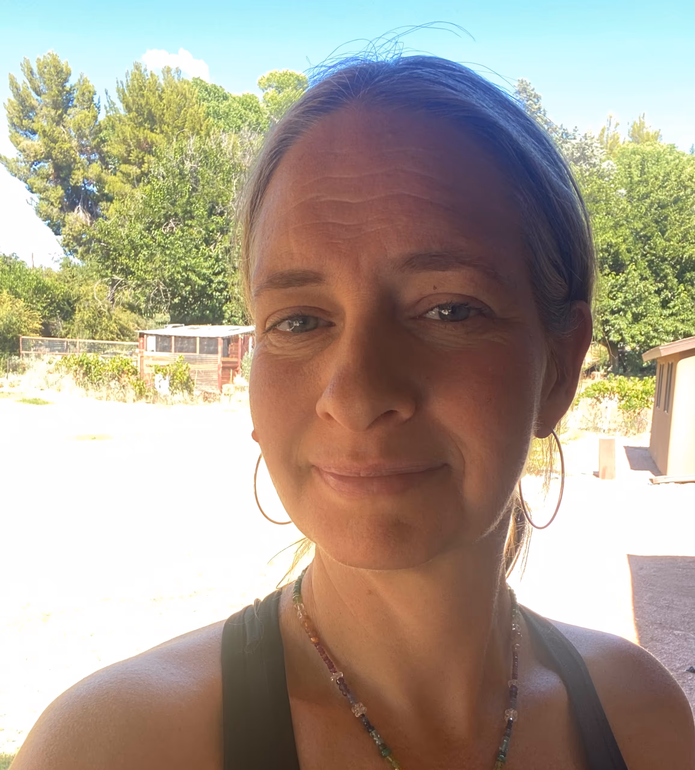 Susan Cote, certified life coach and aromatherapist, in a natural outdoor setting