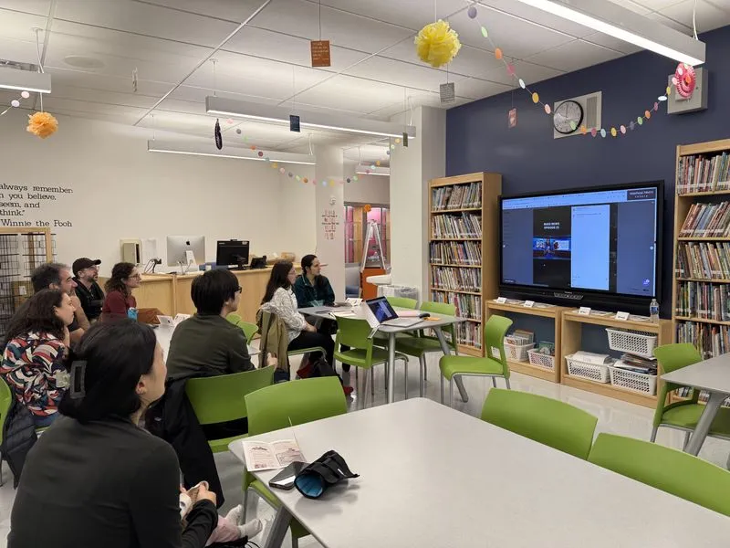 Families attend an ACE information session in a school library
