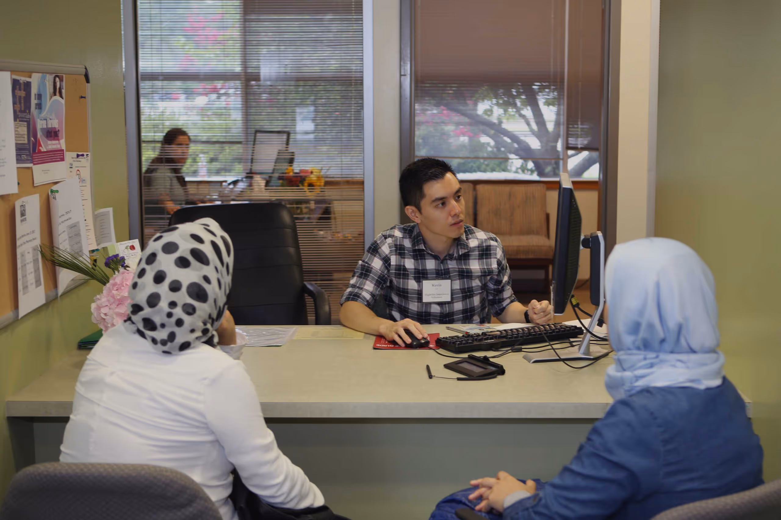 Intern helping patients at the clinic