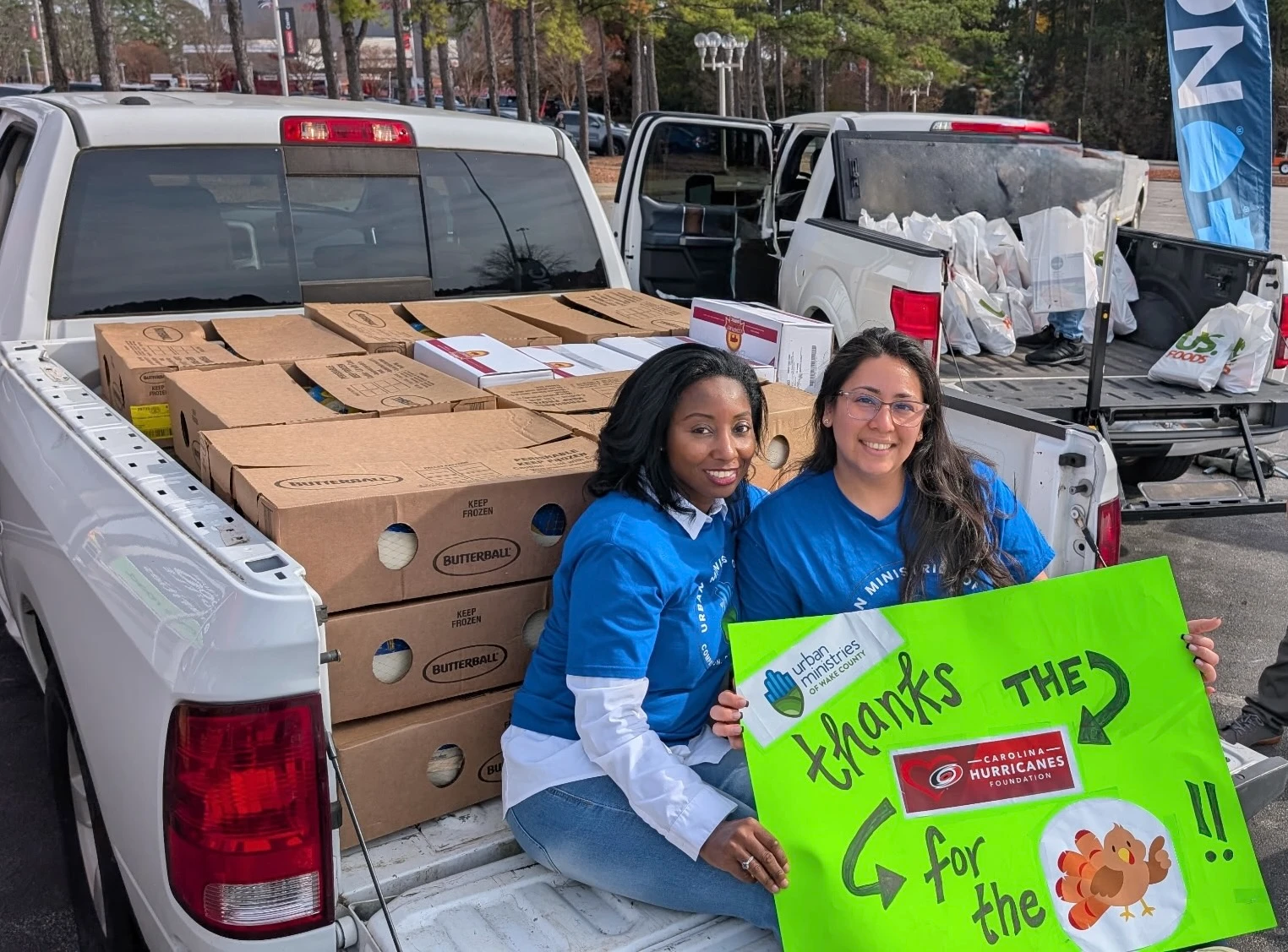 Jessica Holmes, the Executive Director, and Diana Castillo, the Clinical Director helping out at a thanksgiving food drive