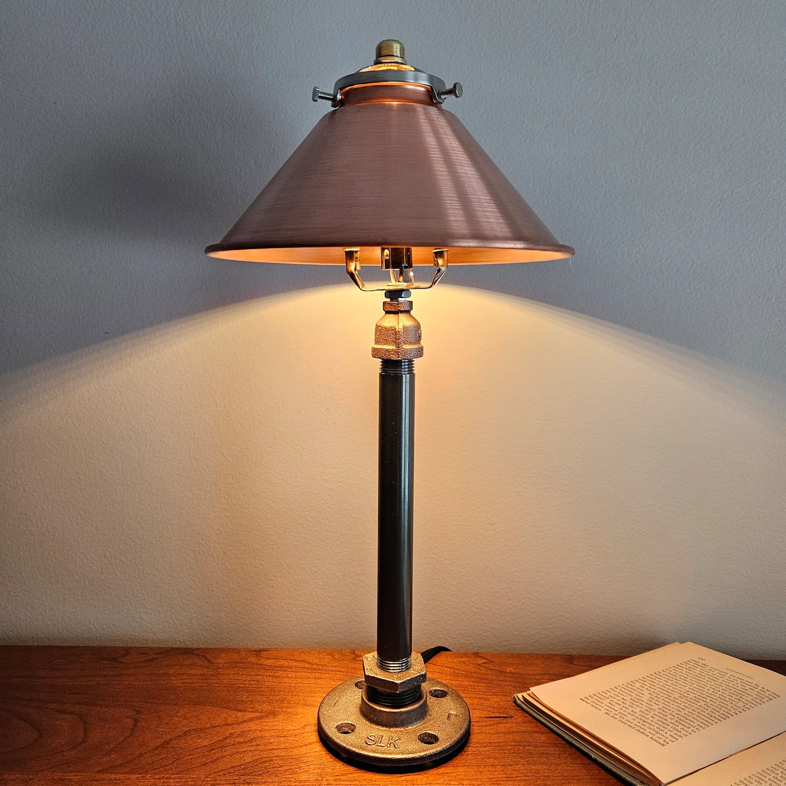 Industrial steampunk desk lamp with copper shade and pipe-style base