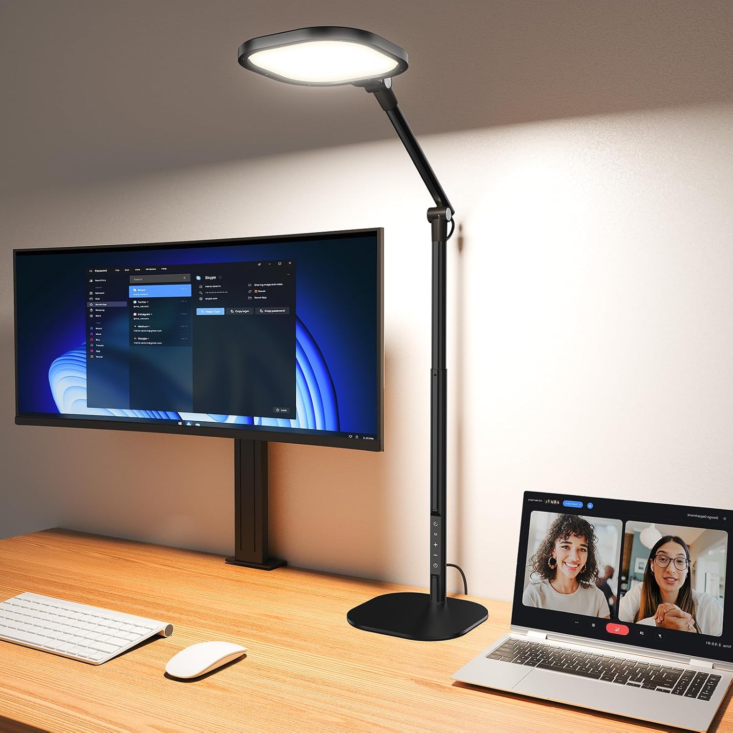 Adjustable black LED desk lamp with tall articulated arm illuminating a modern office desk