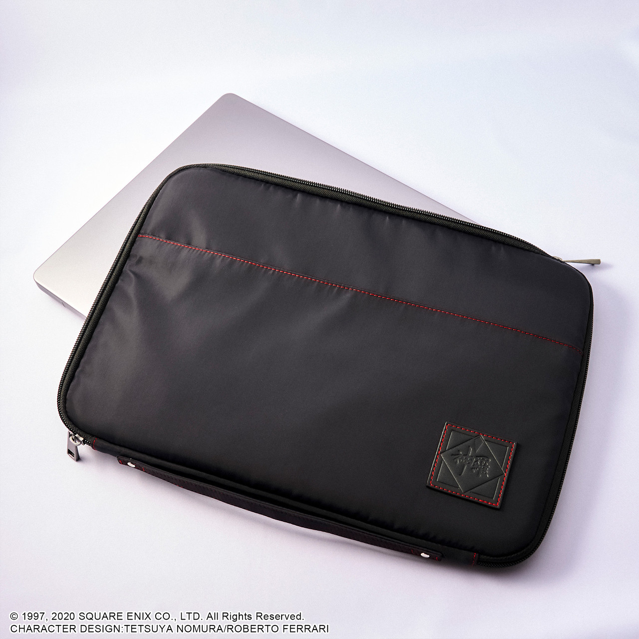 Black Shinra Company laptop and tablet sleeve with minimal branding and structured design.