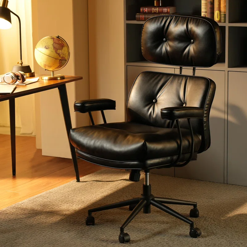 Vintage-style black leather office chair with tufted cushions and swivel base