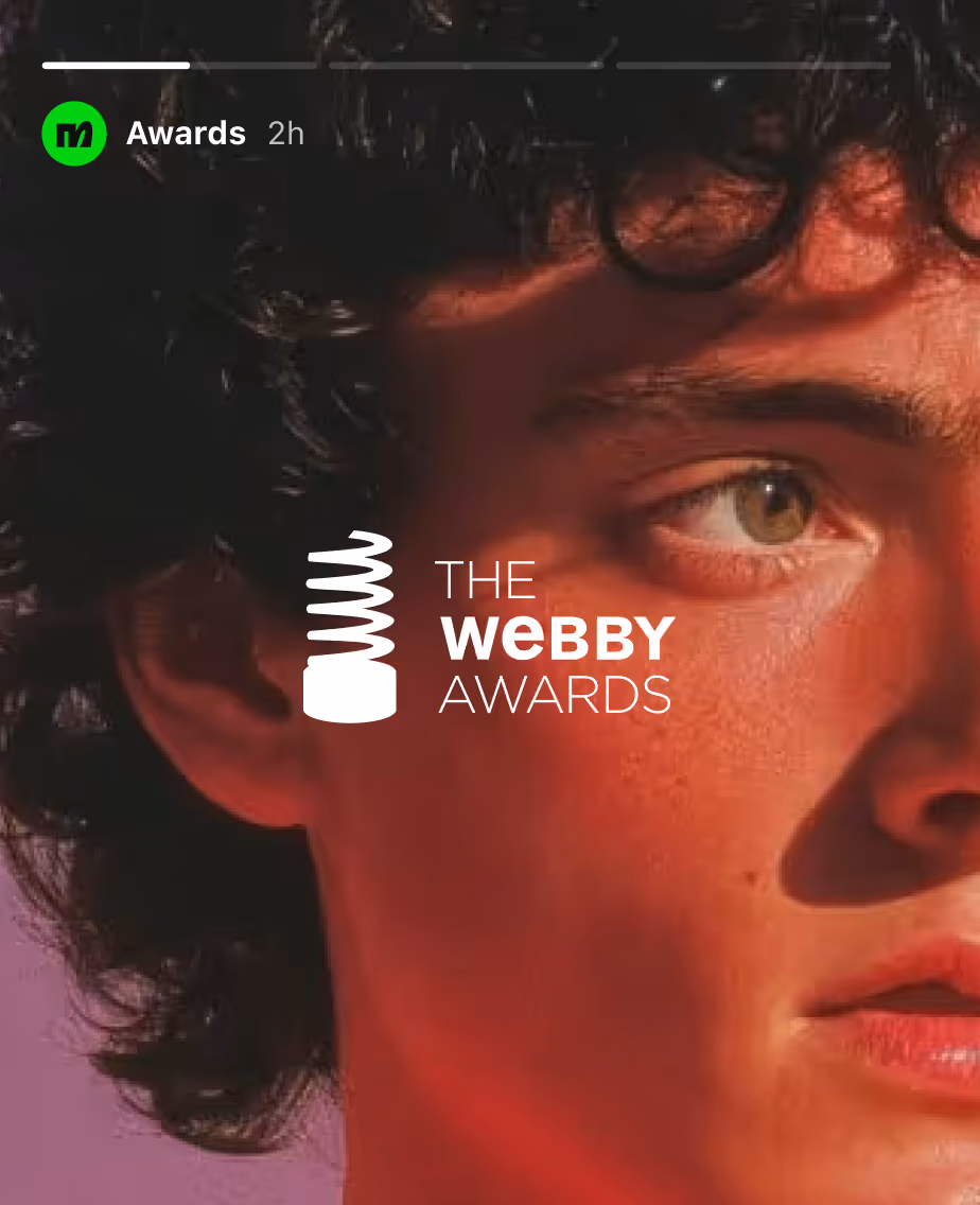 Close-up of a young man’s face with curly hair and The Webby Awards logo overlay.