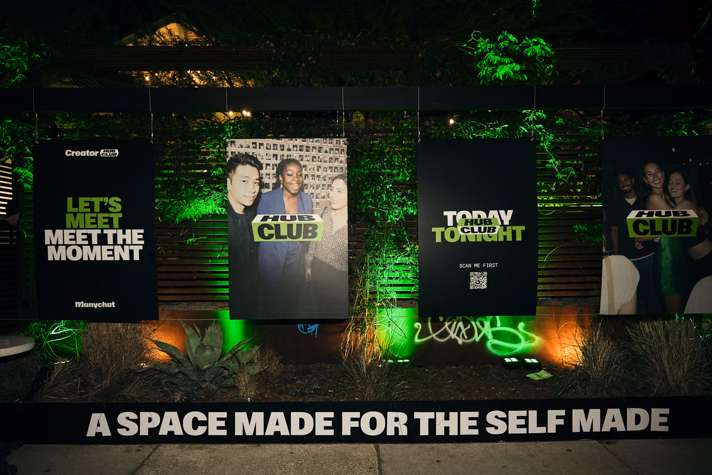 Outdoor hanging banners with messages: Let's Meet, Hub Club photos, Today Tonight, and slogan A Space Made for the Self Made.
