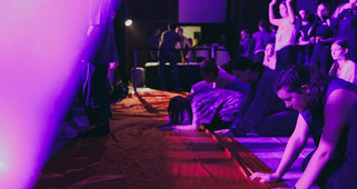 Anna surrendering to God at a healing service