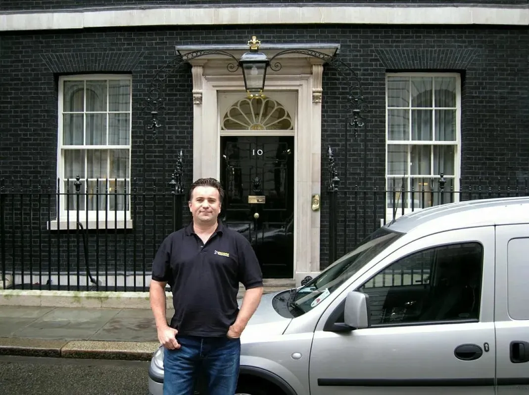 Secure Transportation director finishing a delivery to number 10 Downing Street in London