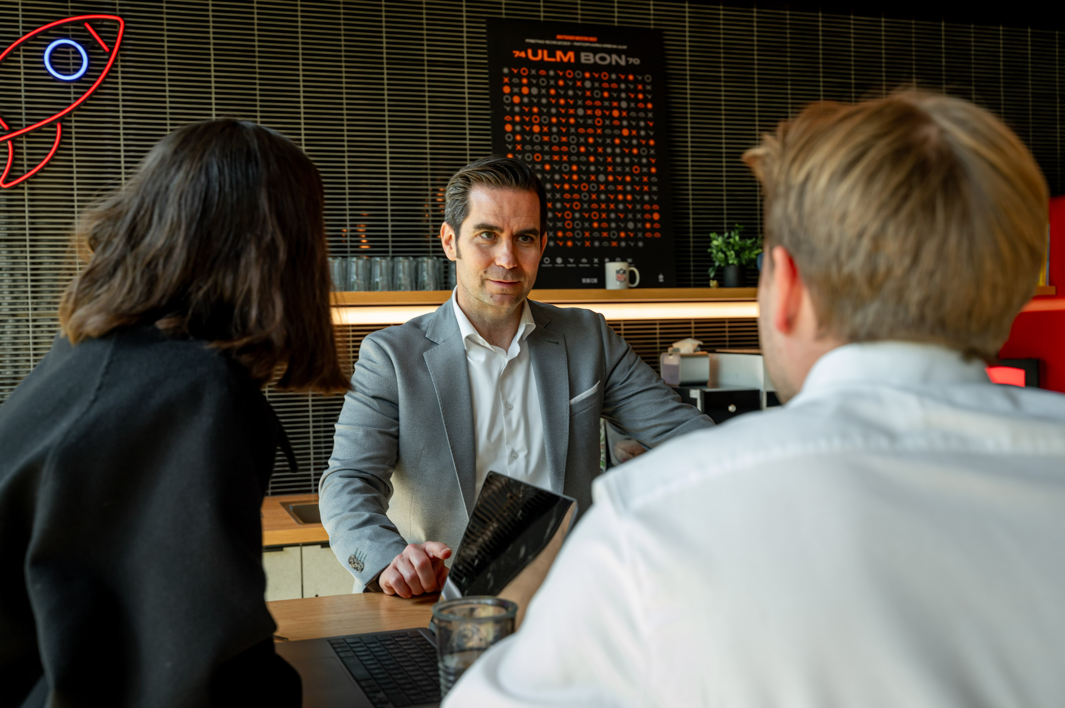 image of hands typing on a laptop with scientific data